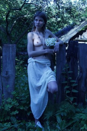 Babe with natural small tits caresses pussy outdoors. photo 4
