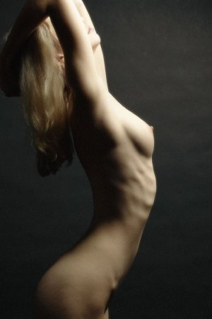 Excited babe plays sex games in the armchair photo 2