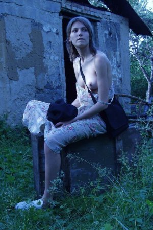 Skinny babe is flashing her boobs outdoors photo 5