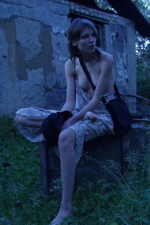 Skinny babe is flashing her boobs outdoors photo 6