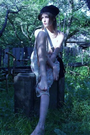 Skinny babe is flashing her boobs outdoors photo 18