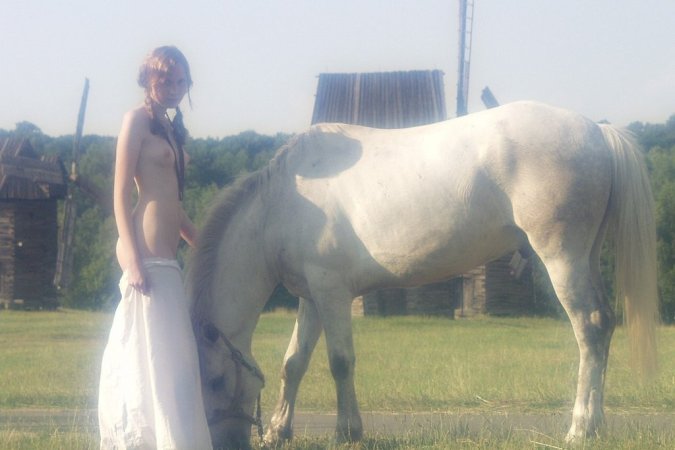 Sexy babe is walking with the horse photo 1