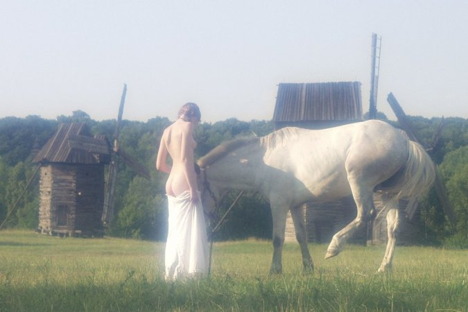 Sexy babe is walking with the horse photo 2