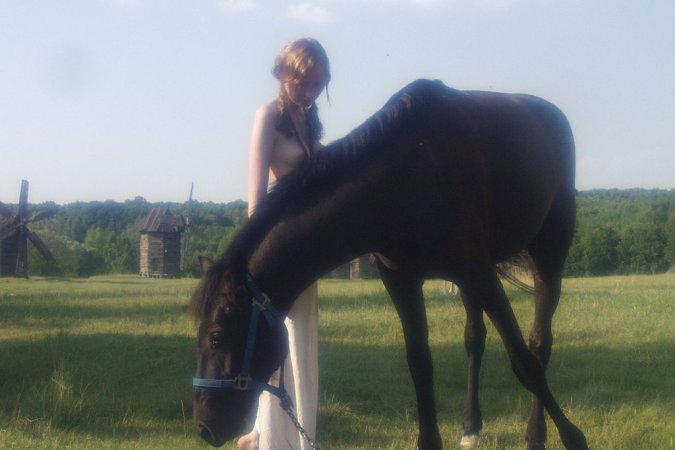 Sexy babe is walking with the horse photo 11