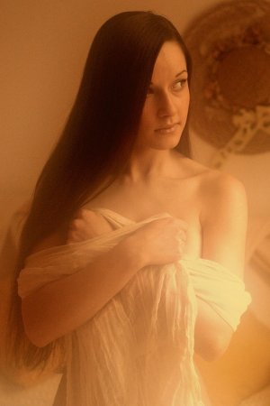 Naked dark-haired hottie plays with candles photo 10