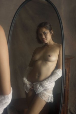 Kinky Asian brunette in front of the mirror photo 16
