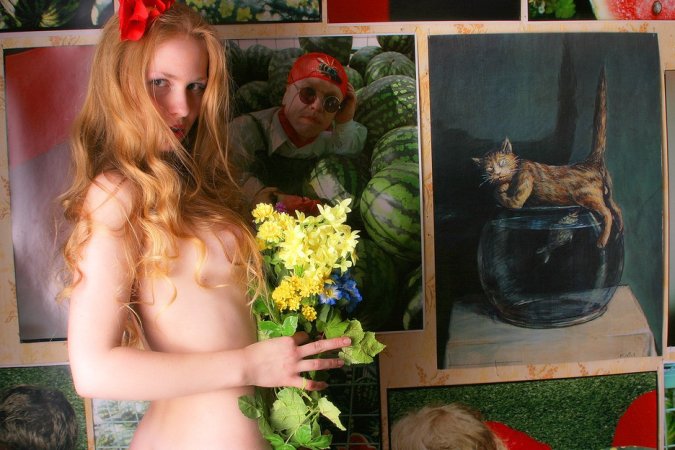 Redhead puts on her nylons and plays with flowers photo 17
