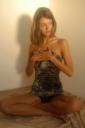 Tender blonde is sitting on the floor and having solo photo 14