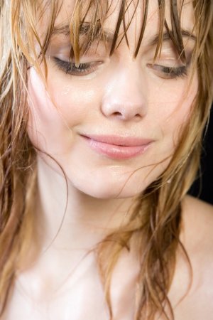 Wet brunette plays with her naked curves photo 10