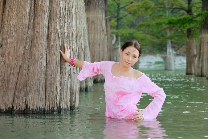 Hottie undresses after taking a swim in the river. photo 17