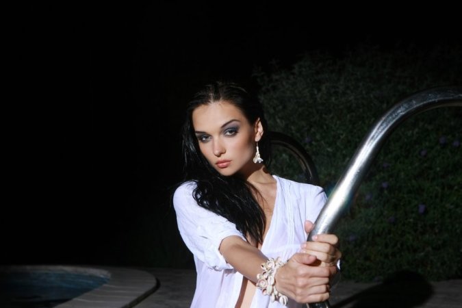 Hot brunette in the awesome pool photo 10