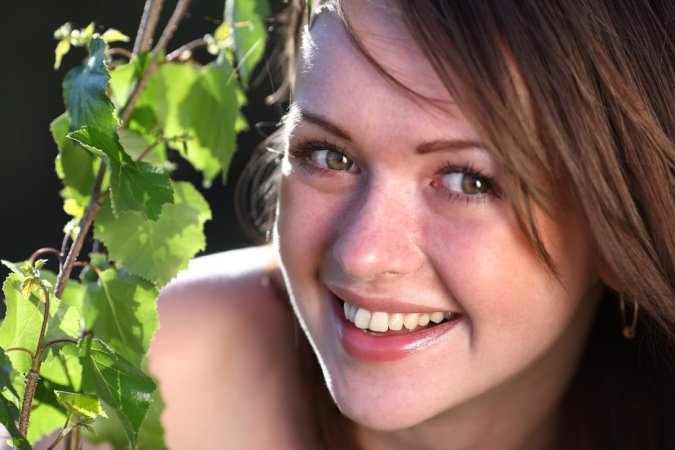 Smiling brunette chick posing outdoors photo 8