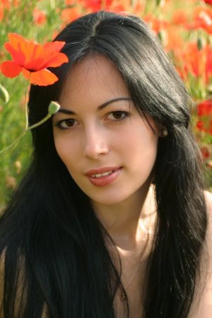 Luxurious brunette among wonderful flowers photo 3