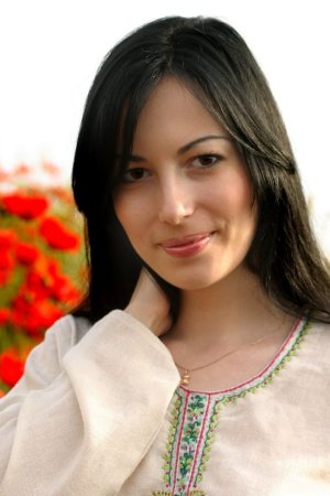 Luxurious brunette among wonderful flowers photo 6