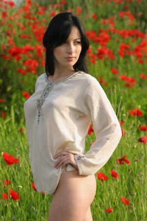 Luxurious brunette among wonderful flowers photo 14