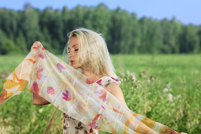 Sensual blonde is showing her naked body outdoors photo 13