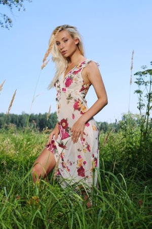 Sensual blonde is showing her naked body outdoors photo 18