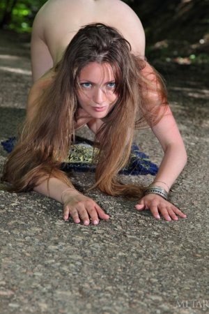 Busty lady is having solo in the forest photo 13
