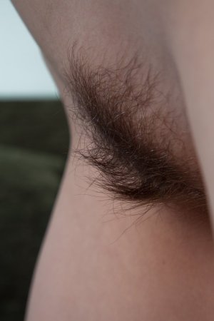 Cute teen showing off her hairy pussy photo 15