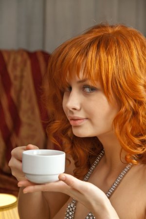 Ginger babe is eating strawberry being naked photo 10