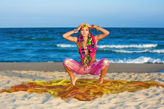Hot lady in colorful bikini is having solo on the beach photo 1