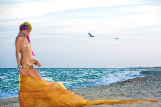 Hot lady in colorful bikini is having solo on the beach photo 2