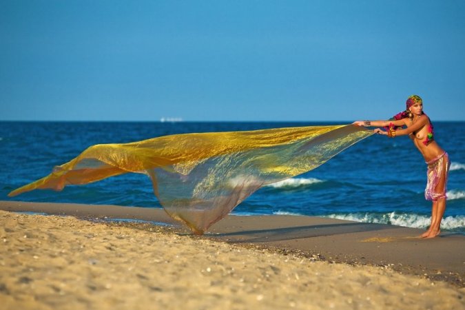 Hot lady in colorful bikini is having solo on the beach photo 7
