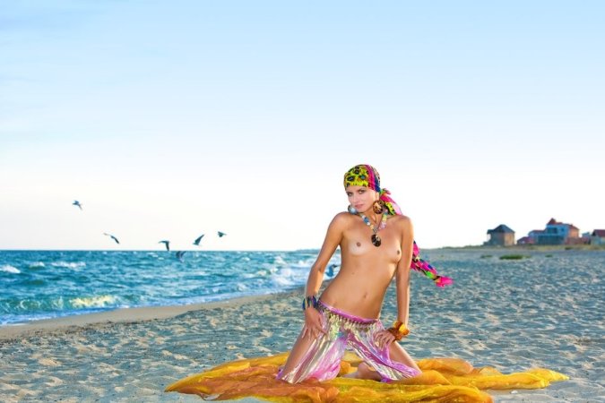 Hot lady in colorful bikini is having solo on the beach photo 18
