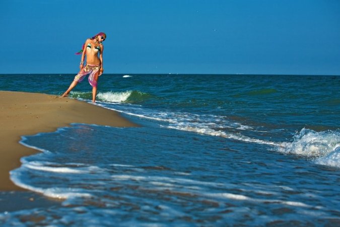 Hot lady in colorful bikini is having solo on the beach photo 20