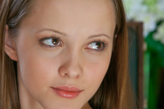 Young model is getting naked and satisfying herself photo 18