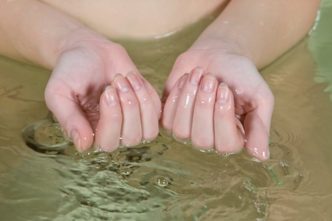 Lovely blonde is enjoying solo in the water photo 5