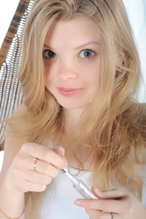 Gentle blonde takes clothes off in the hammock. photo 8