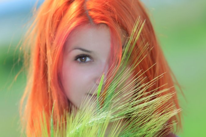 Hot red-haired babe goes into the field to masturbate photo 18