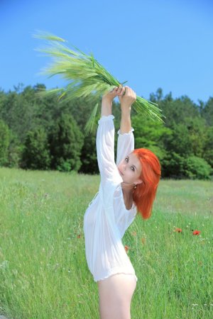 Hot red-haired babe goes into the field to masturbate photo 19