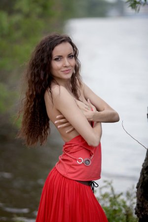 Spreading her pussy out by the lake photo 3
