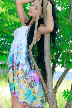 Brunette allows breeze to caress her hairy pussy photo 13