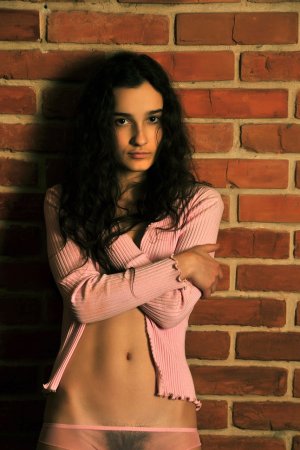 Cutie takes off her tight pink outfit. photo 4