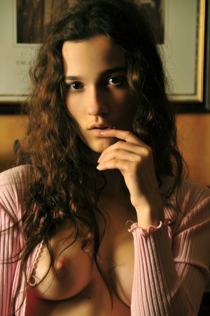 Cutie takes off her tight pink outfit. photo 5