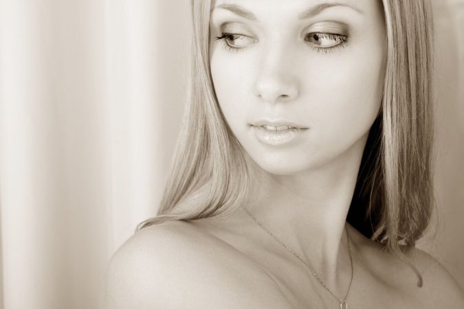 Blonde model gets naked and artistic photo 4
