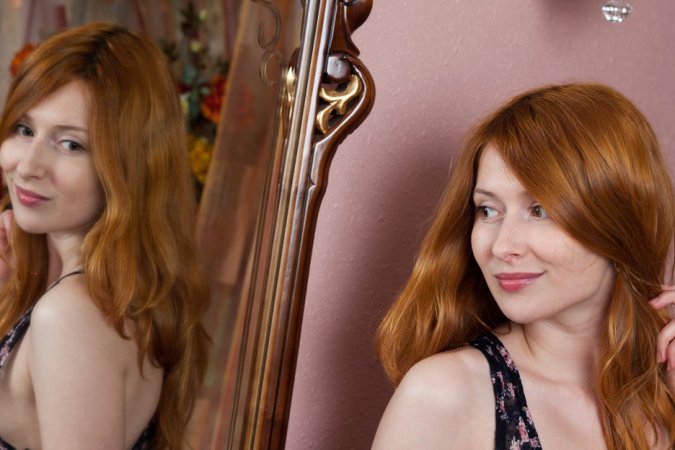 Ginger babe masturbates on her balcony. photo 10