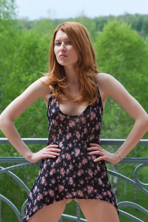 Ginger babe masturbates on her balcony. photo 11