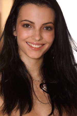 Dark-haired chick dances on the floor and table. photo 13