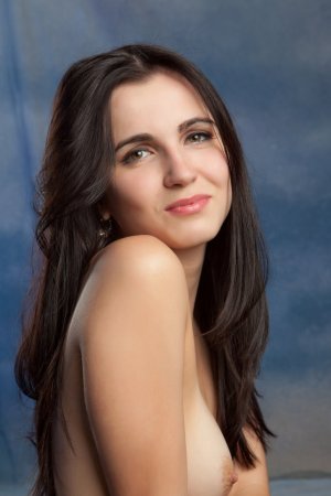 Slim dark-haired babe plays with her naked legs photo 5