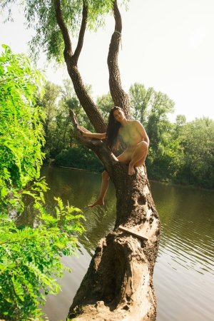 Naked babe swims in the local river photo 16