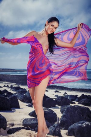Sexy brunette is enjoying solo on the beach photo 9