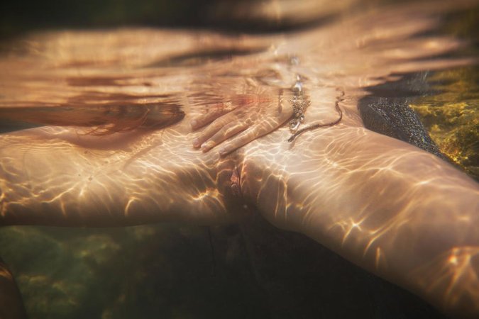 Naked babe dives totally naked into warm water. photo 11