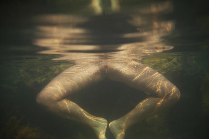 Naked babe dives totally naked into warm water. photo 13