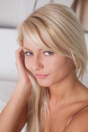 Petite blonde gal showing her sexy appeal photo 1