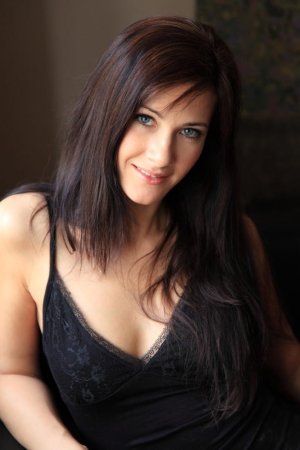 Sweet chick masturbates on leather couch. photo 3