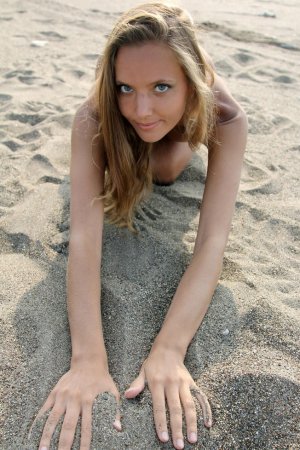 Hottie enjoys hot sand and warm breeze on beach photo 8
